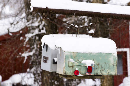 Mail boxes covered in snow in rural area.のeditorial素材