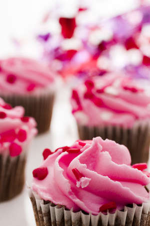 Pink Valentine's day cupcakes on white background.の写真素材