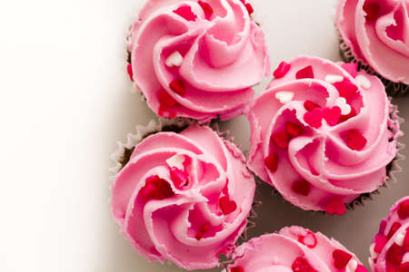 Pink Valentine's day cupcakes on white background.の写真素材