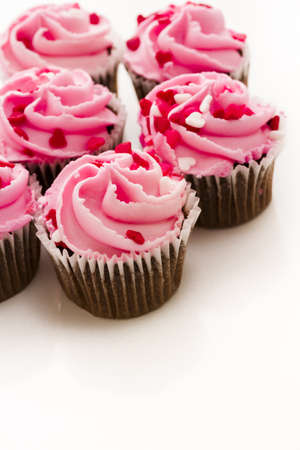 Pink Valentine's day cupcakes on white background.の写真素材
