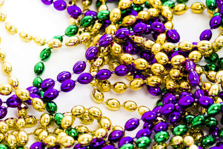 Mardi Gras beads on white backgound.の写真素材