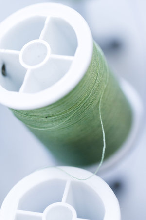 Colorful spools of thread on the wall in tailor shop.