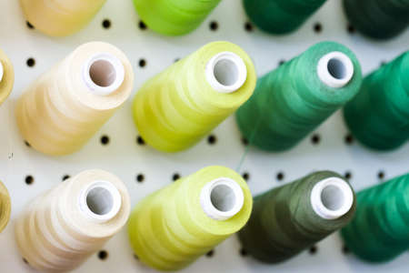 Colorful spools of thread on the wall in tailor shop.のeditorial素材