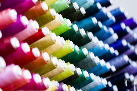 Colorful spools of thread on the wall in tailor shop.のeditorial素材
