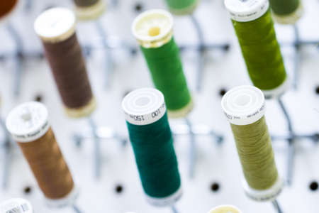 Colorful spools of thread on the wall in tailor shop.のeditorial素材