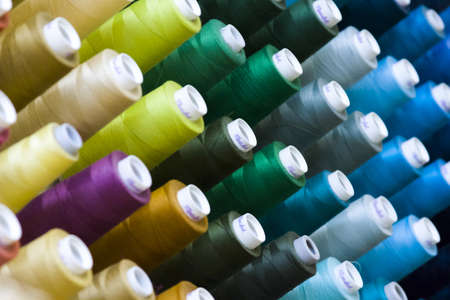 Colorful spools of thread on the wall in tailor shop.のeditorial素材