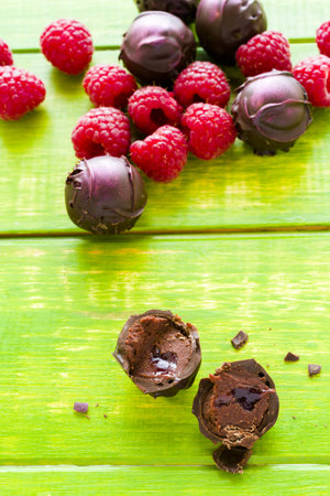 Gourmet raspberry truffles hand made by chocolatier.の写真素材