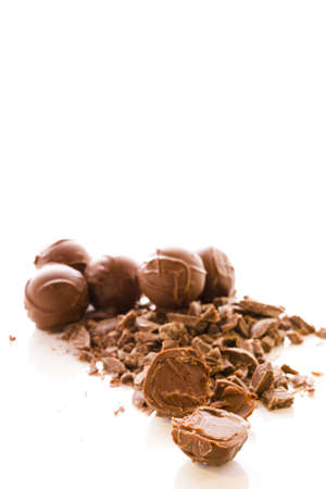 Gourmet milk chocolate truffles hand made by chocolatier.の写真素材