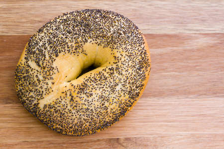 Freshly baked poppyseed bagel.の写真素材