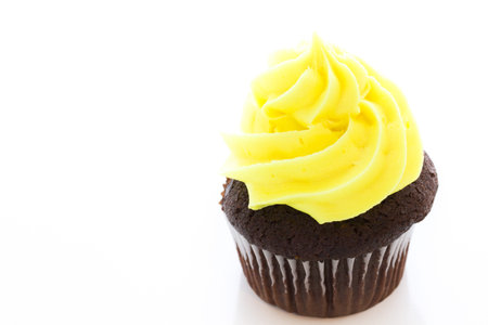 Gourmet cupcakes with yellow icing prepared for Easter.