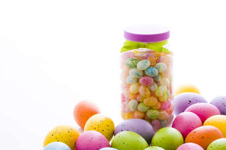 Assorted jelly beans in pastel colors with darker spots.の写真素材