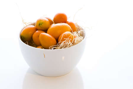 Organic kumquats on a white background.の写真素材