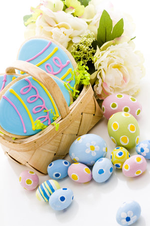 Easter cookies in shape of egg decorated with blue icing.