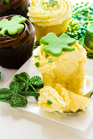 White chocolate cupcakes with white chic mousse and white buttercream frosting for St. Patrics Day.