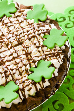Chic pie crust with chic mousse and white chic mint mousse with whip cream on top.