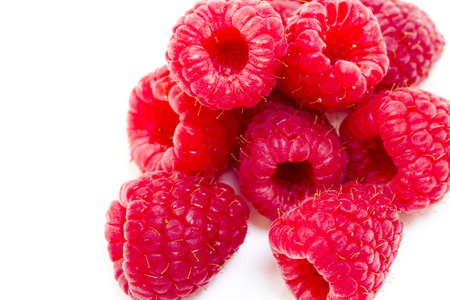 Heap of organic raspberries on white background.の写真素材