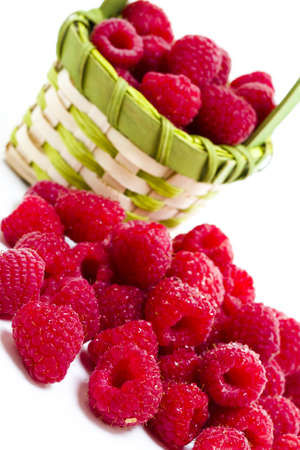 Heap of organic raspberries on white background.の写真素材