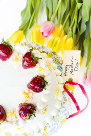 Chocolate Strawberry Lemon Torte made with 6 layers of chocolate cake, filled with lemon curd and strawberry mousse, covered in white chocolate cream cheese frosting.の写真素材