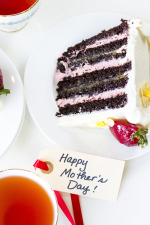 Chocolate Strawberry Lemon Torte made with 6 layers of chocolate cake, filled with lemon curd and strawberry mousse, covered in white chocolate cream cheese frosting.の写真素材