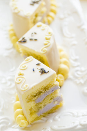White chocolate honey lavender cake made with sponge cake infused with honey and filled with layers of lavender mousse, covered in white chocolate.の写真素材