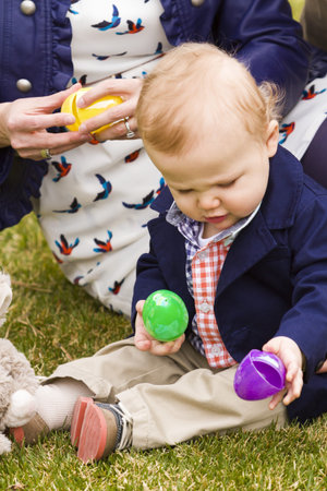 A young family with baby boy in the park on a nice Spring day.
