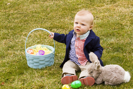A young family with baby boy in the park on a nice Spring day.