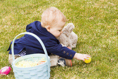 A young family with baby boy in the park on a nice Spring day.