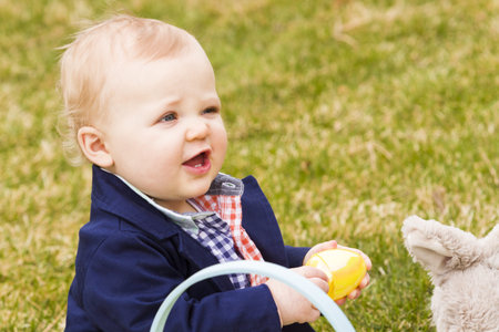 A young family with baby boy in the park on a nice Spring day.