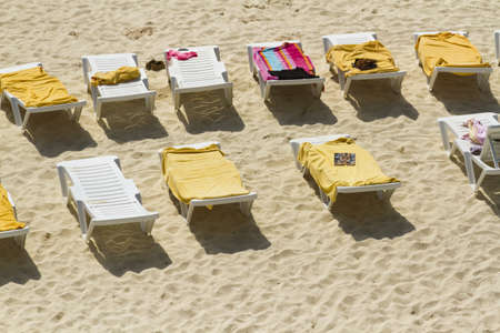 White chairs on the beach of the Caribbean Sea.のeditorial素材