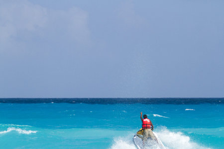 Having fun on jet ski at the Caribbian sea.