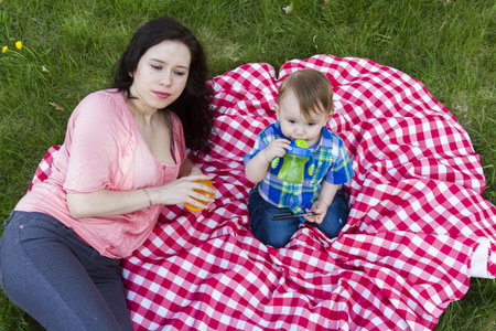 Young mother playing with her baby boy.の写真素材