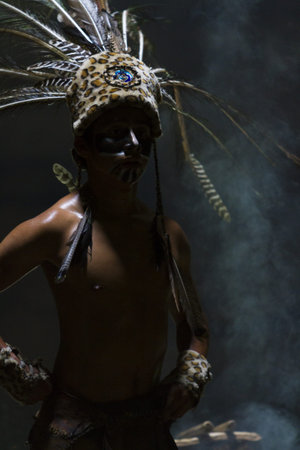 Maya people dressed in traditional mayan outfit for performance.