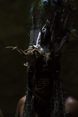 Maya people dressed in traditional mayan outfit for performance.