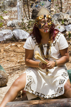 Maya people dressed in traditional mayan outfit for performance.