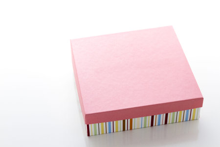 Box of assorted gourmet truffles on a white background.