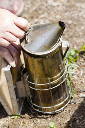 Smoker for beekeeper to manage bee hive.の写真素材