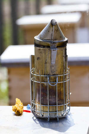 Smoker for beekeeper to manage bee hive.の写真素材