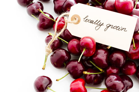 Heap of fresh cherries on a white background.の写真素材