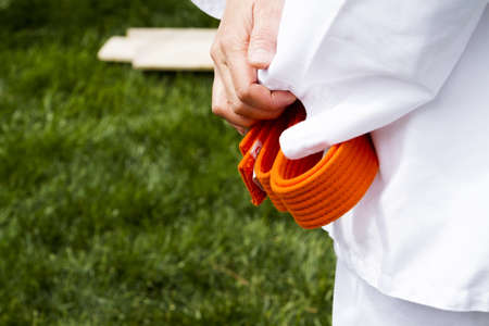 Tae Kwon Do student practicing in the park.の写真素材