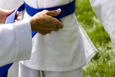 Tae Kwon Do student practicing in the park.の写真素材
