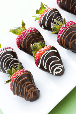 Chocolate dipped strawberries at dessert bar.の写真素材