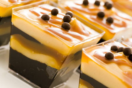 Small chocolate caramel parfait cups at dessert bar.の写真素材