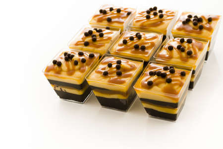 Small chocolate caramel parfait cups at dessert bar.の写真素材