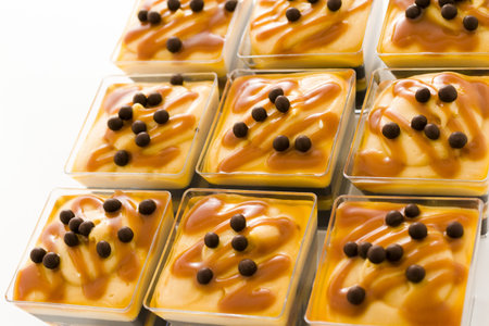 Small chocolate caramel parfait cups at dessert bar.の写真素材