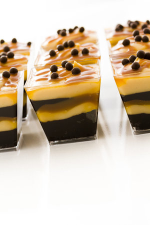 Small chocolate caramel parfait cups at dessert bar.の写真素材
