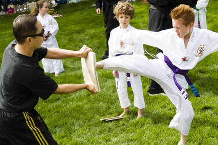 Tae Kwon Do student practicing in the park.のeditorial素材