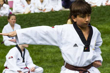 Tae Kwon Do student practicing in the park.のeditorial素材