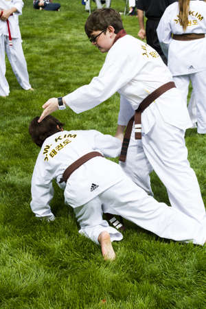 Tae Kwon Do student practicing in the park.のeditorial素材