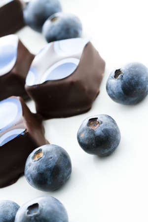 Blueberry truffles on a white background.の写真素材