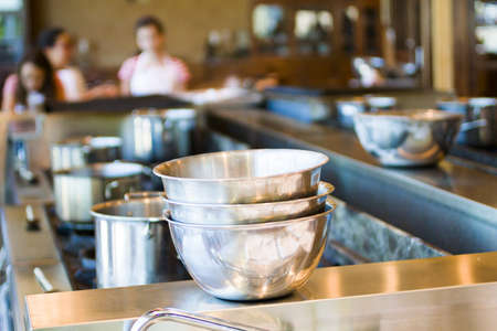 Kids learning how to cook in cooking school.の写真素材